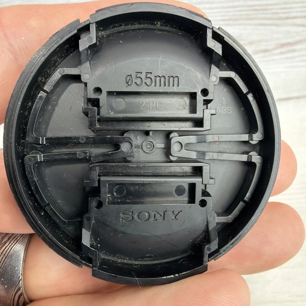 SONY ALPHA 55mm LENS FRONT COVER Black Genuine
